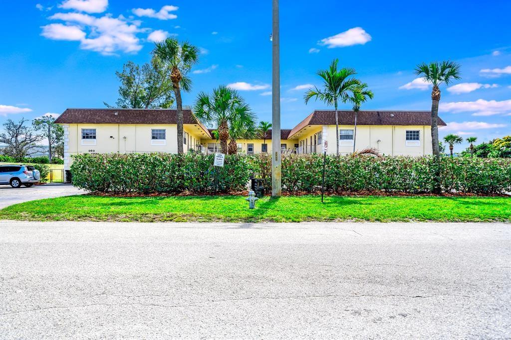 260 Northwest 19th Street, Unit 28 Boca Raton, FL 33432 - Photo 11 of 26 a front view of house with yard and green space