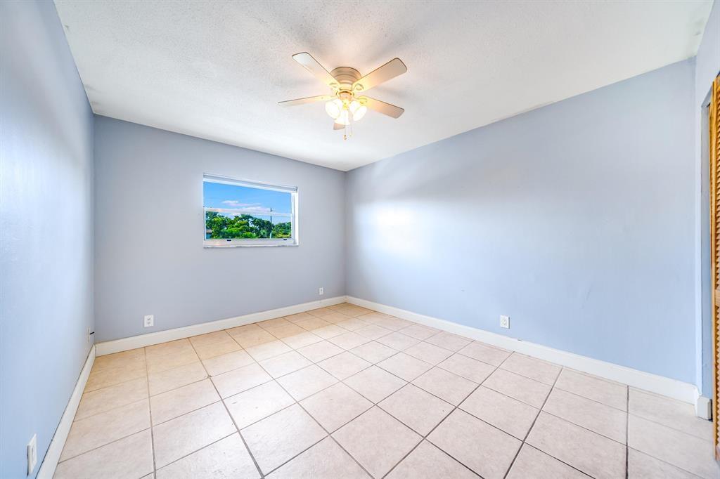 260 Northwest 19th Street, Unit 28 Boca Raton, FL 33432 - Photo 13 of 26 a view of an empty room with a window