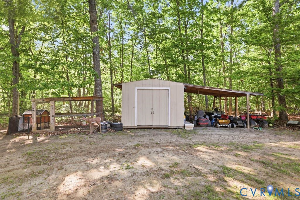 5307 St Pauls Church Road Goochland, VA 23063 - Photo 38 of 44 a view of a small house with large trees
