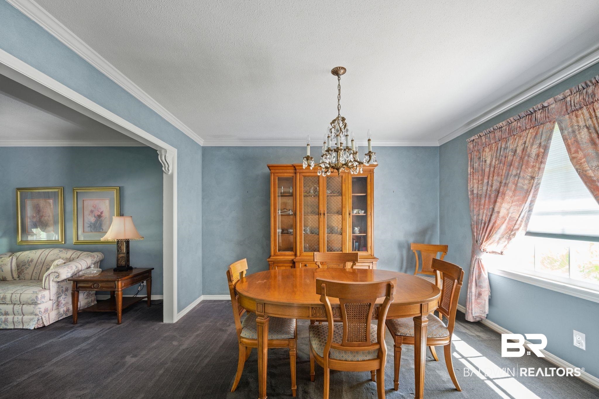 950 Walter Smith Road Mobile, AL 36695 - Photo 10 of 51 Dining area with a chandelier, dark colored carpet, baseboards, and crown molding