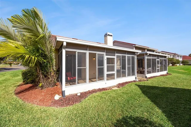 a view of a swimming pool with a lounge chairs