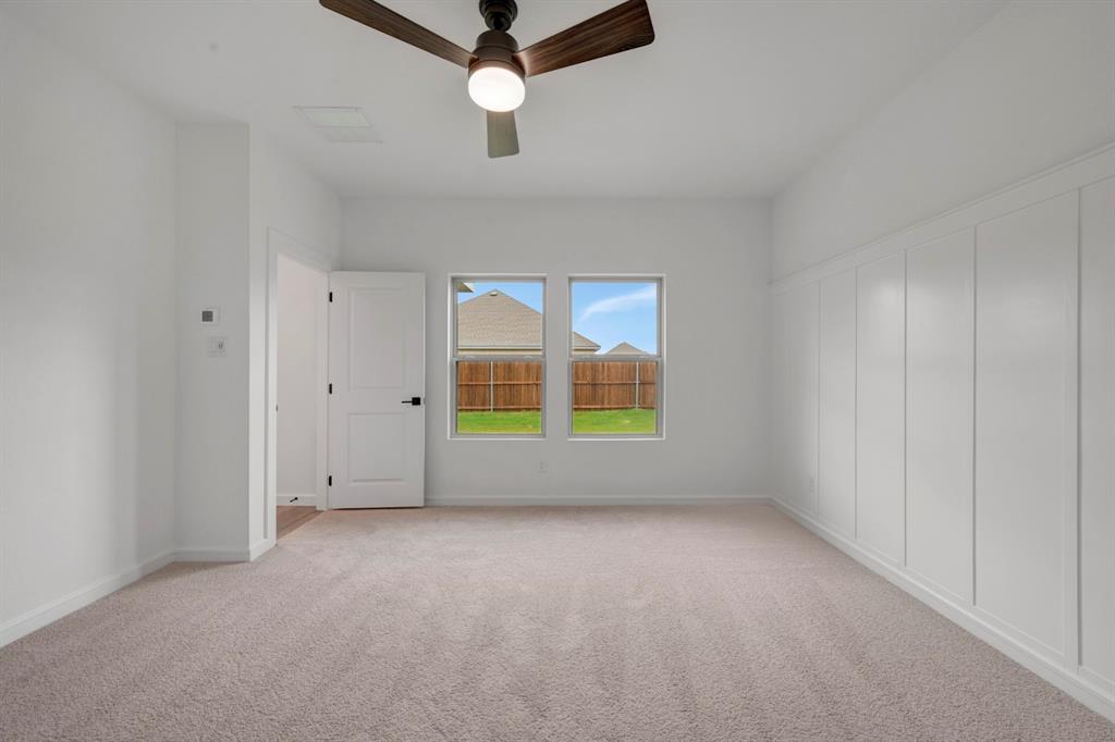 536 Brookside Drive Van Alstyne, TX 75495 - Photo 14 of 30 an empty room with windows and fan