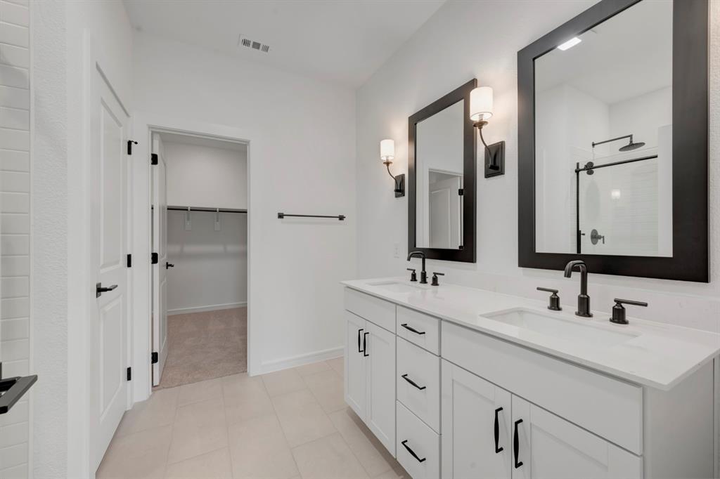 536 Brookside Drive Van Alstyne, TX 75495 - Photo 15 of 30 a bathroom with a double vanity sink mirror and