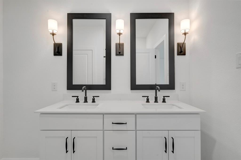 536 Brookside Drive Van Alstyne, TX 75495 - Photo 16 of 30 a bathroom with double vanity sinks and a mirror