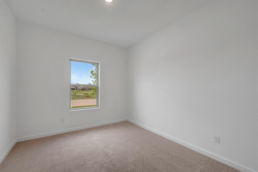 536 Brookside Drive Van Alstyne, TX 75495 - Photo 18 of 30 an empty room with a window
