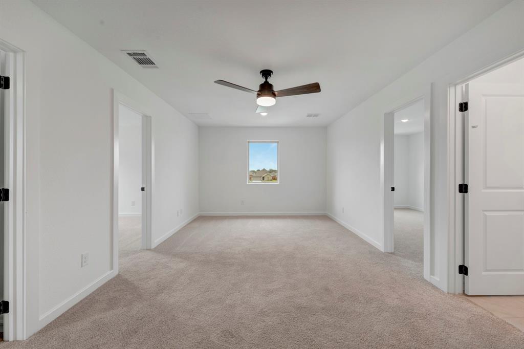 536 Brookside Drive Van Alstyne, TX 75495 - Photo 20 of 30 an empty room and chandelier fan in a room