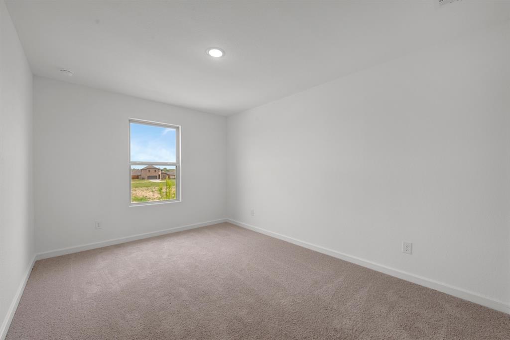 536 Brookside Drive Van Alstyne, TX 75495 - Photo 21 of 30 a view of an empty room with a window