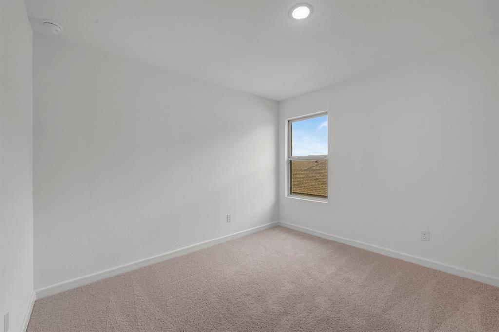 536 Brookside Drive Van Alstyne, TX 75495 - Photo 22 of 30 a view of an empty room with a window