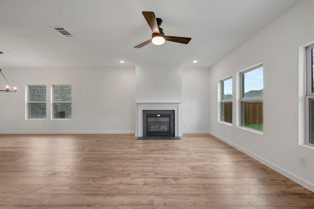 536 Brookside Drive Van Alstyne, TX 75495 - Photo 5 of 30 a living room with hardwood floor and a ceiling fan