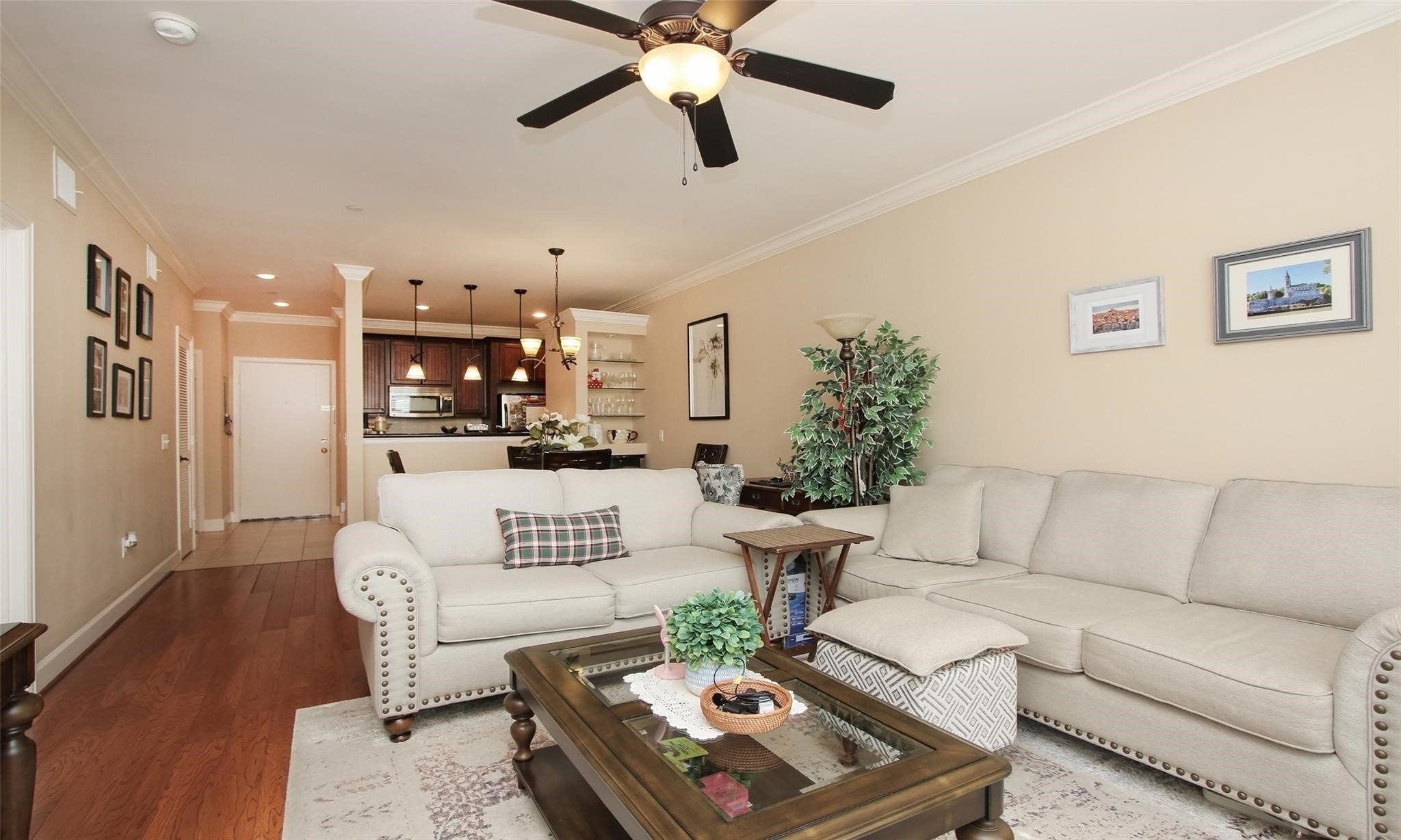 a living room with furniture and a chandelier