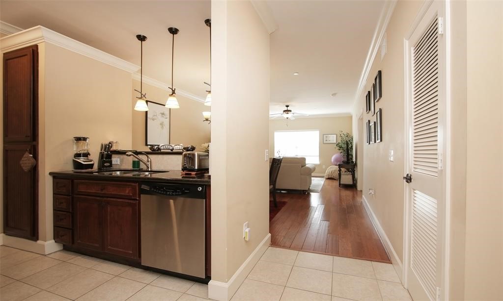2203 Dorrington Street, Unit 208 Houston, TX 77030 - Photo 11 of 32 a kitchen with a sink and cabinets