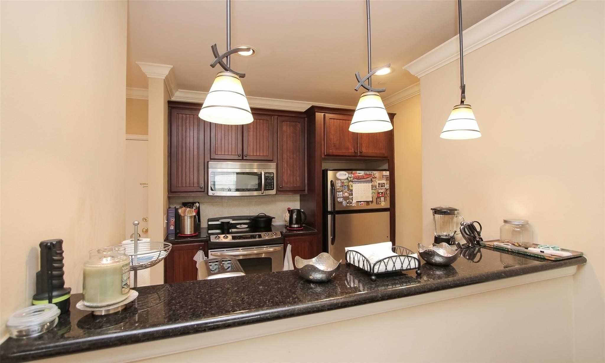 2203 Dorrington Street, Unit 208 Houston, TX 77030 - Photo 13 of 32 a kitchen with a refrigerator a stove and a sink with wooden floor