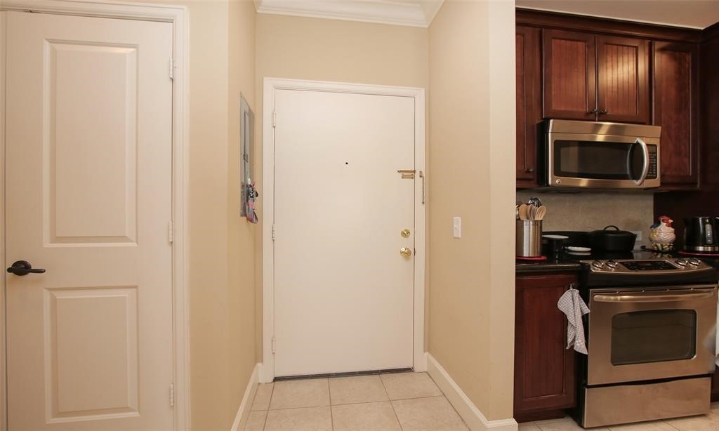2203 Dorrington Street, Unit 208 Houston, TX 77030 - Photo 14 of 32 a kitchen with a refrigerator stove and microwave