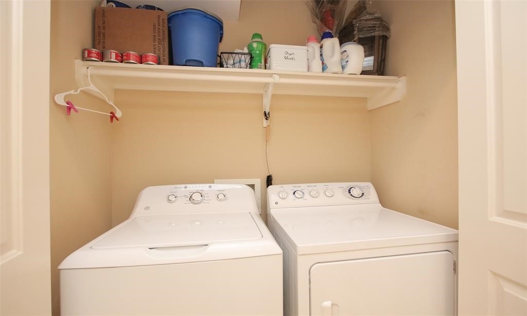 2203 Dorrington Street, Unit 208 Houston, TX 77030 - Photo 16 of 32 a utility room with dryer and washer
