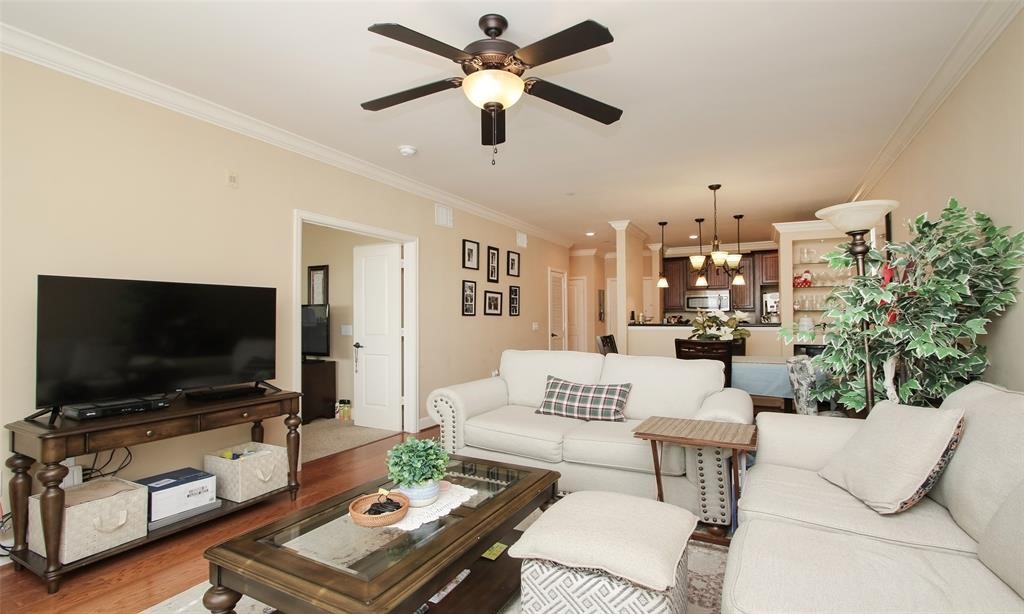 2203 Dorrington Street, Unit 208 Houston, TX 77030 - Photo 2 of 32 a living room with furniture and a flat screen tv