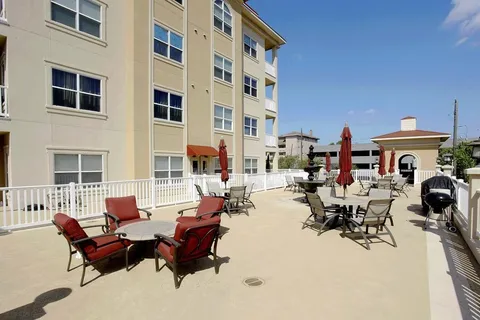 a view of a backyard with wooden fence