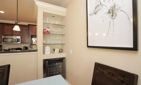 a kitchen with a sink and a refrigerator