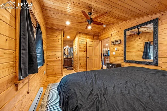 a view of walk in closet with clothes