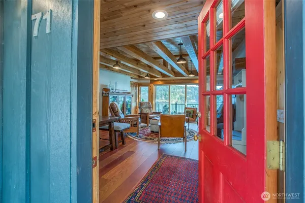 a view of living room with furniture and wooden floor