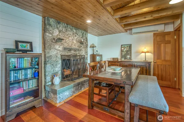 a view of a dining room with furniture wooden floor and a chandelier