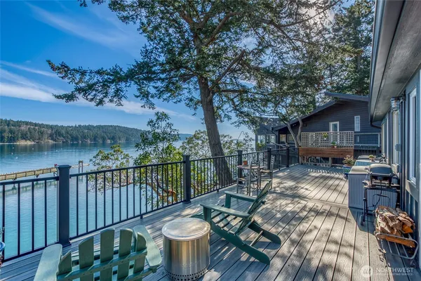 a view of balcony with furniture and wooden deck