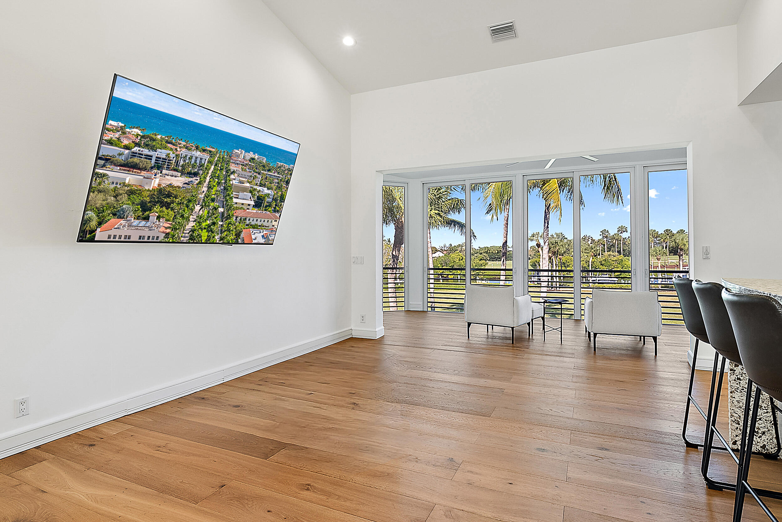 1602 Captains Way Jupiter, FL 33477 - Photo 4 of 36 a view of an empty room with wooden floor and a window