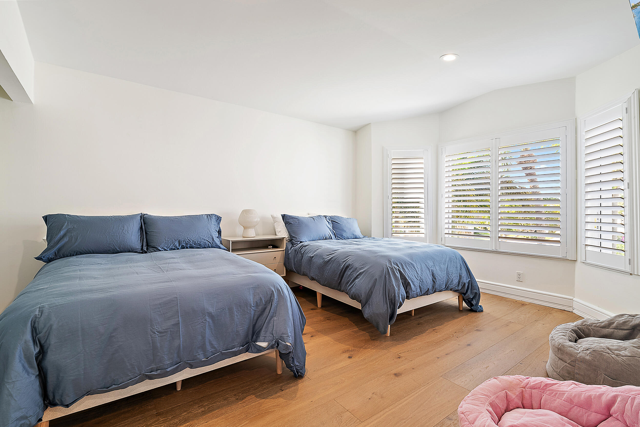 1602 Captains Way Jupiter, FL 33477 - Photo 9 of 36 a spacious bedroom with two beds and a couch