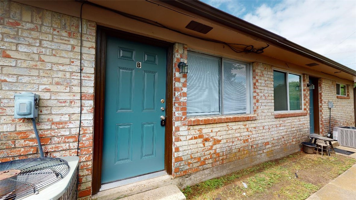 213 Ehlinger Drive, Unit B Bryan, TX 77801 - Photo 1 of 17 a view of house with patio