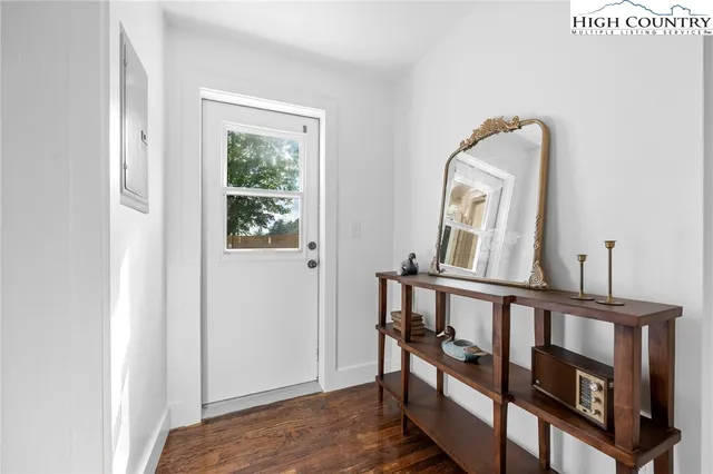 a view of a livingroom with furniture and staircase