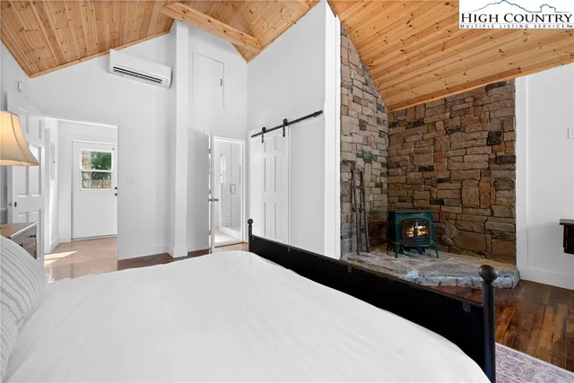 a bedroom with a bed and a table