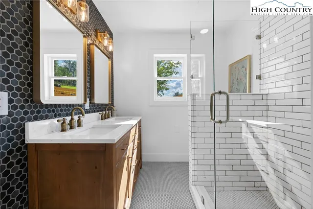 a bathroom with a sink a vanity and a mirror