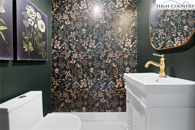 a bathroom with a toilet and a sink