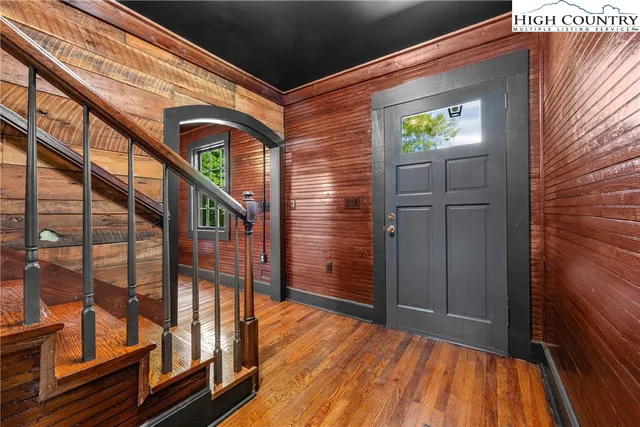 a bedroom with a bed and hallway