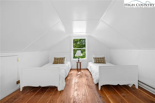 a view of a porch with wooden floor and outdoor space