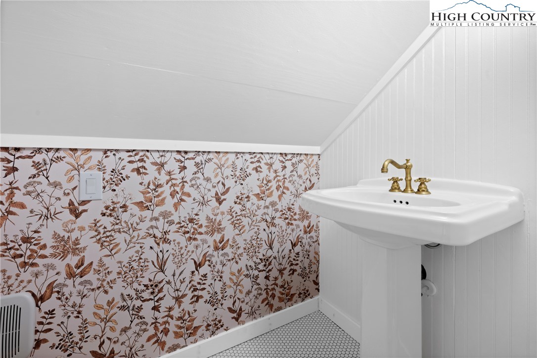 160 Old Tpke E Road Banner Elk, NC 28604 - Photo 41 of 50 a bathroom with a sink and mirror