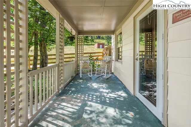 a view of outdoor sitting area with swimming pool