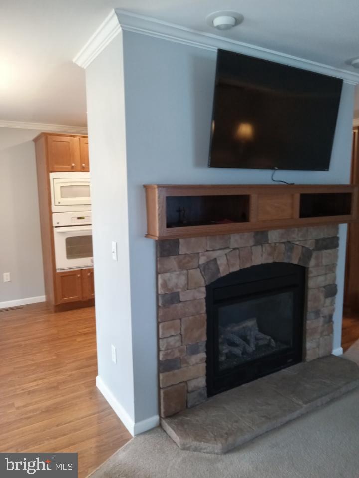 150 Random Road Douglassville, PA 19518 - Photo 16 of 32 a living room with a fireplace and a flat screen tv