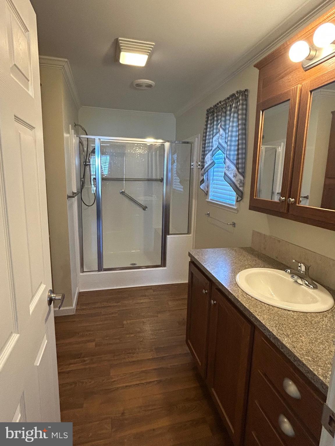 150 Random Road Douglassville, PA 19518 - Photo 23 of 32 a bathroom with a granite countertop sink a mirror and shower