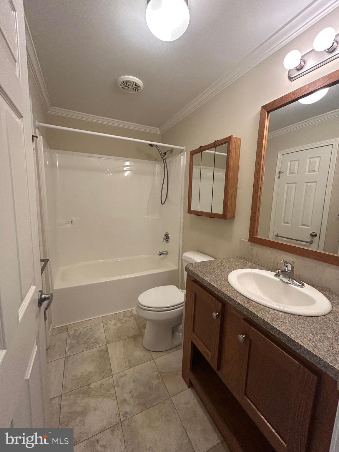 150 Random Road Douglassville, PA 19518 - Photo 25 of 32 a bathroom with a granite countertop sink toilet a mirror and shower