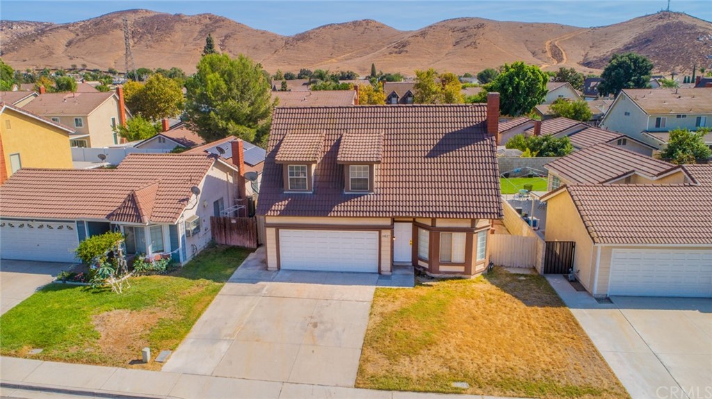 14027 Hillcrest Drive Fontana, CA 92337 - Photo 1 of 1 a house with a outdoor space