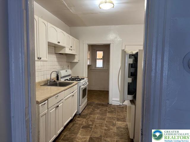 208 Ridge Avenue Allentown, PA 18102 - Photo 5 of 17 a kitchen with stainless steel appliances granite countertop a refrigerator and a sink