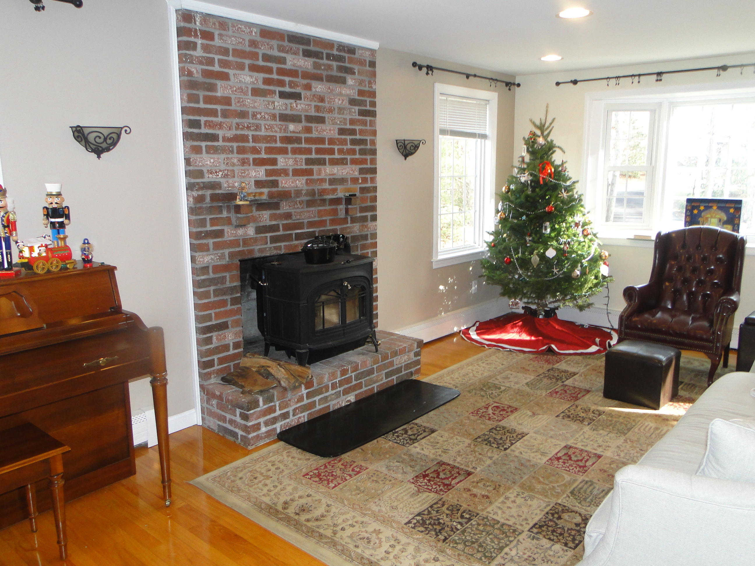 10 Bayview Road East Sandwich, MA 02537 - Photo 11 of 19 a living room with furniture and a fireplace