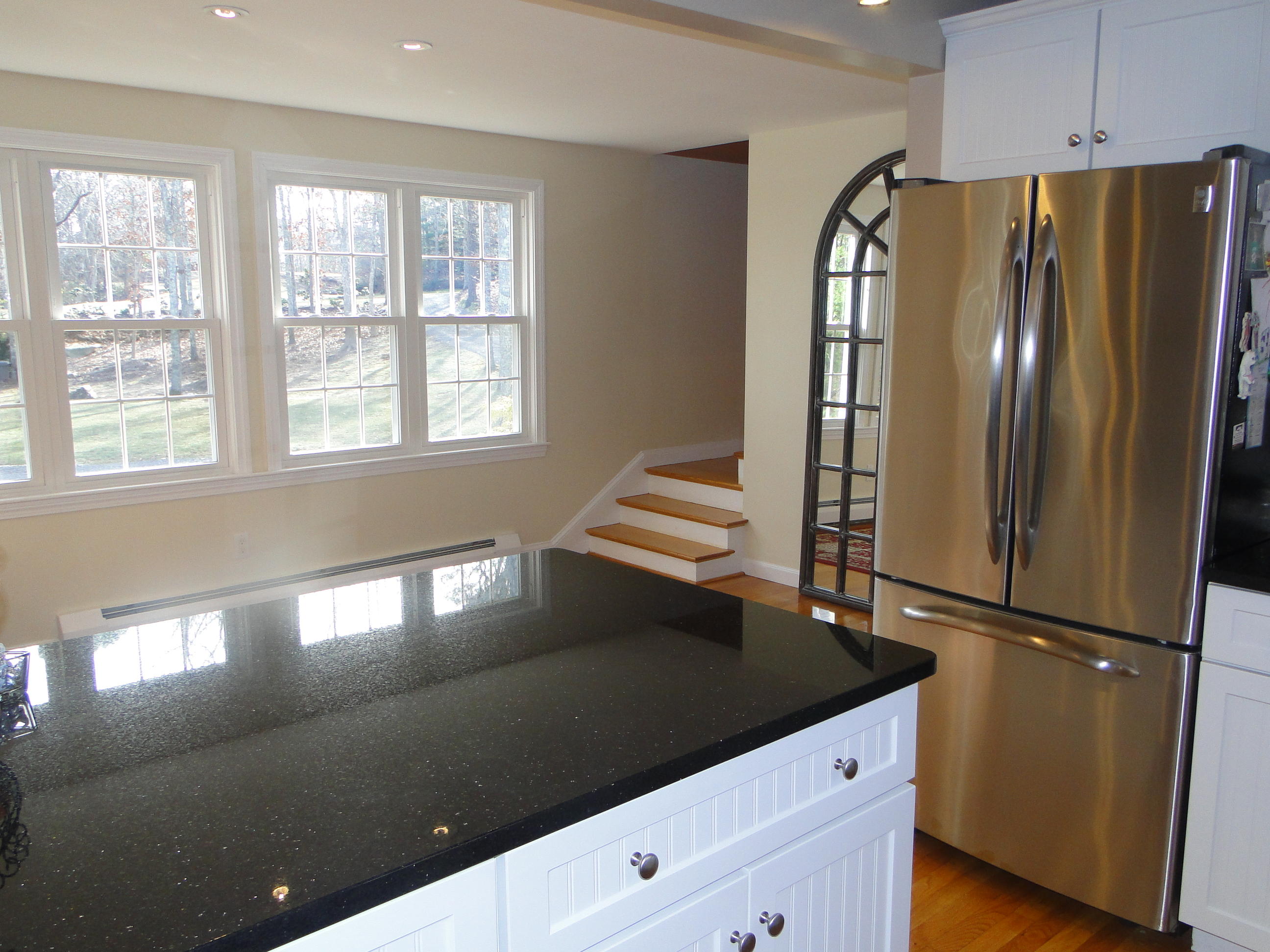10 Bayview Road East Sandwich, MA 02537 - Photo 4 of 19 a kitchen with granite countertop a refrigerator a stove a sink and a window