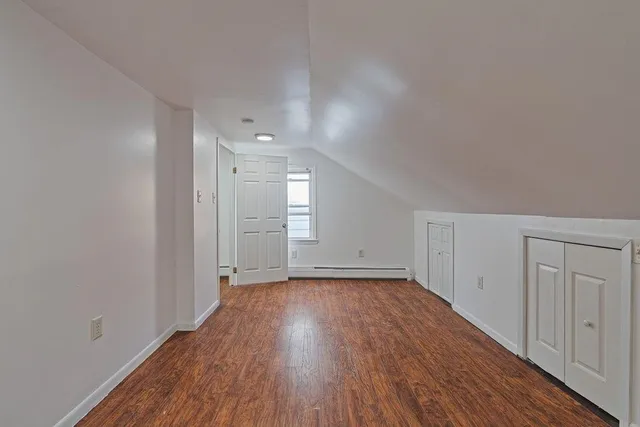 a view of a room with wooden floors and led lights