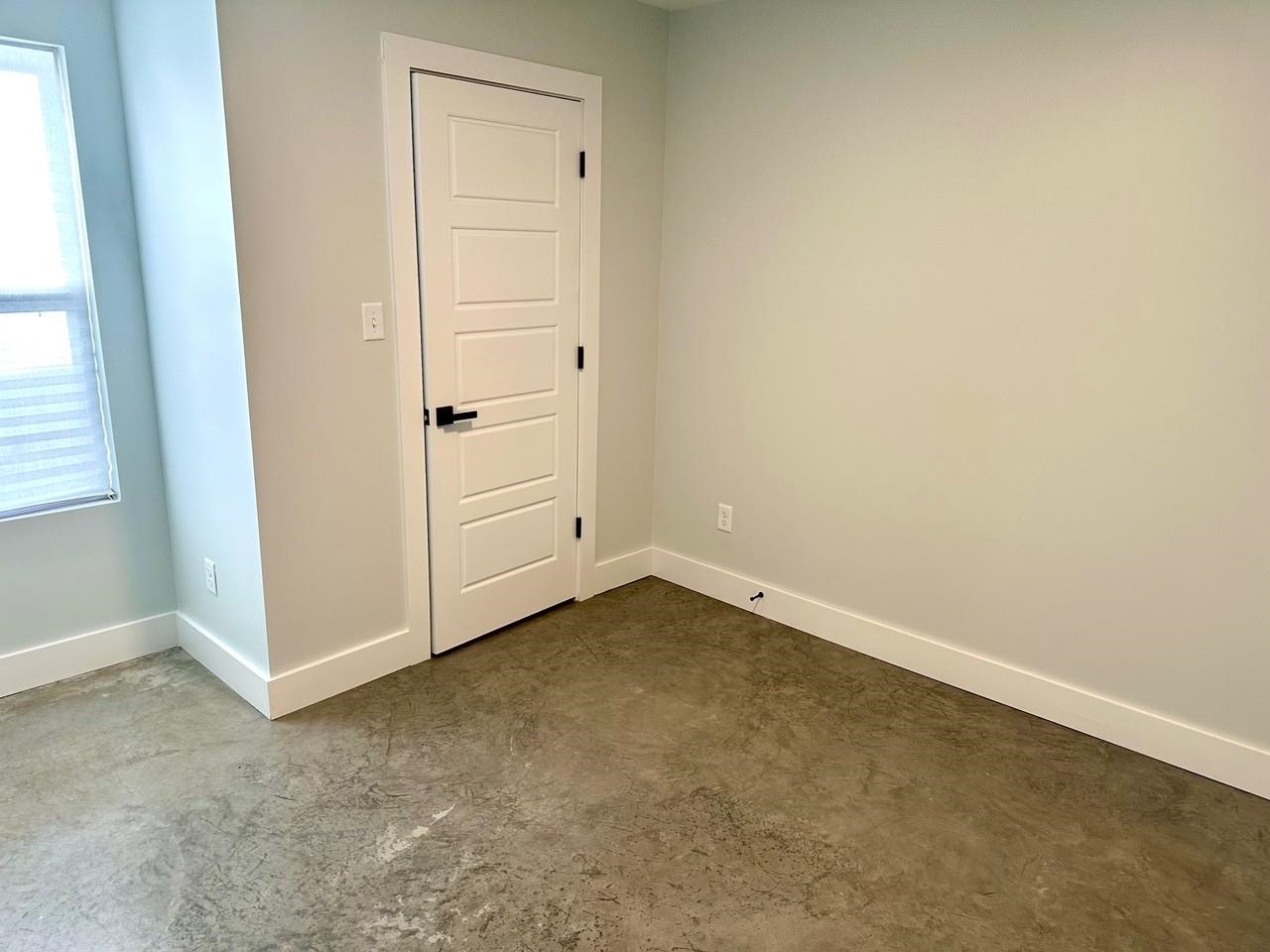 853 Hanley Street Memphis, TN 38114 - Photo 12 of 12 Unfurnished room featuring concrete floors and baseboards