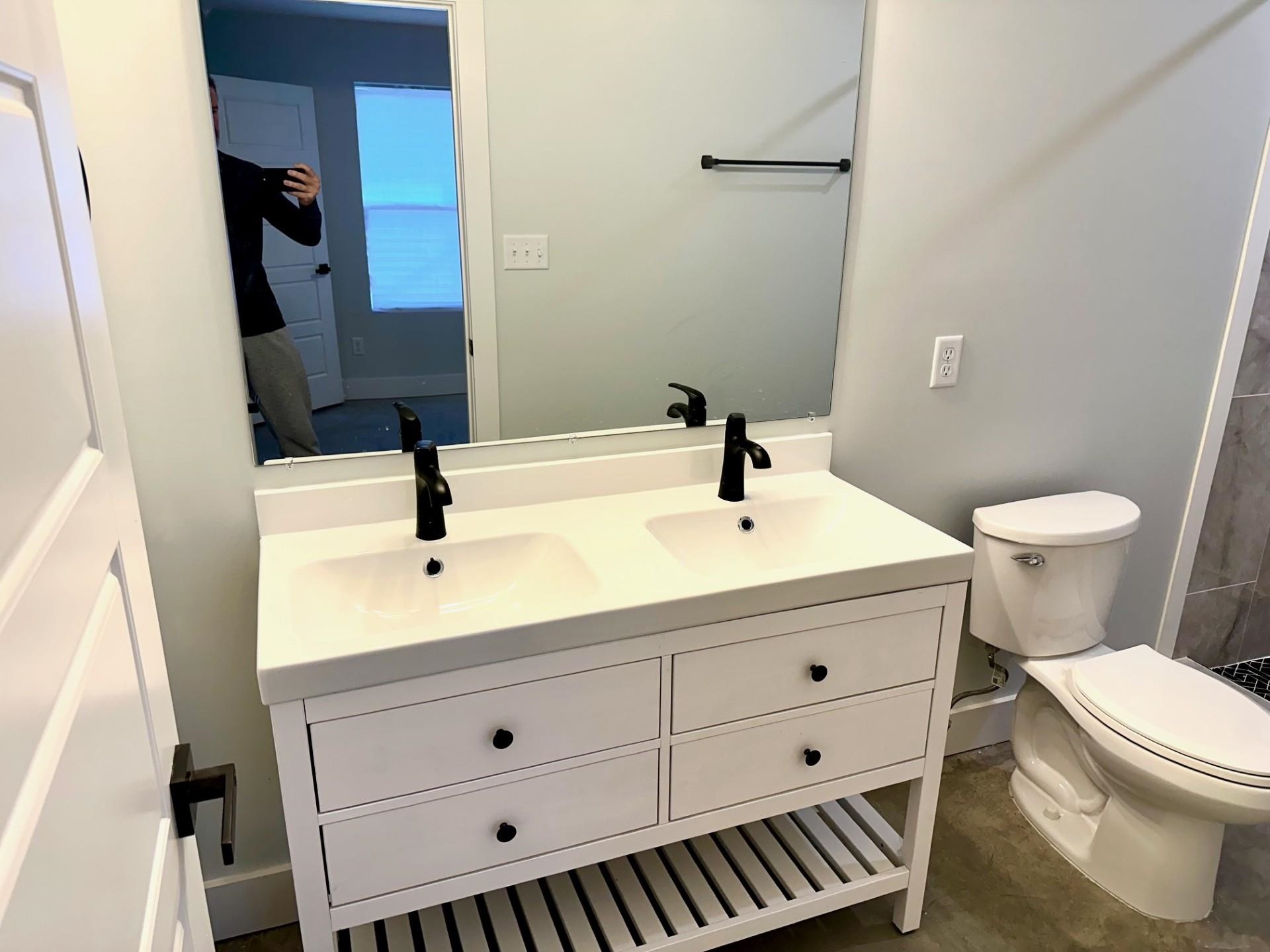 853 Hanley Street Memphis, TN 38114 - Photo 7 of 12 Bathroom featuring double vanity and toilet