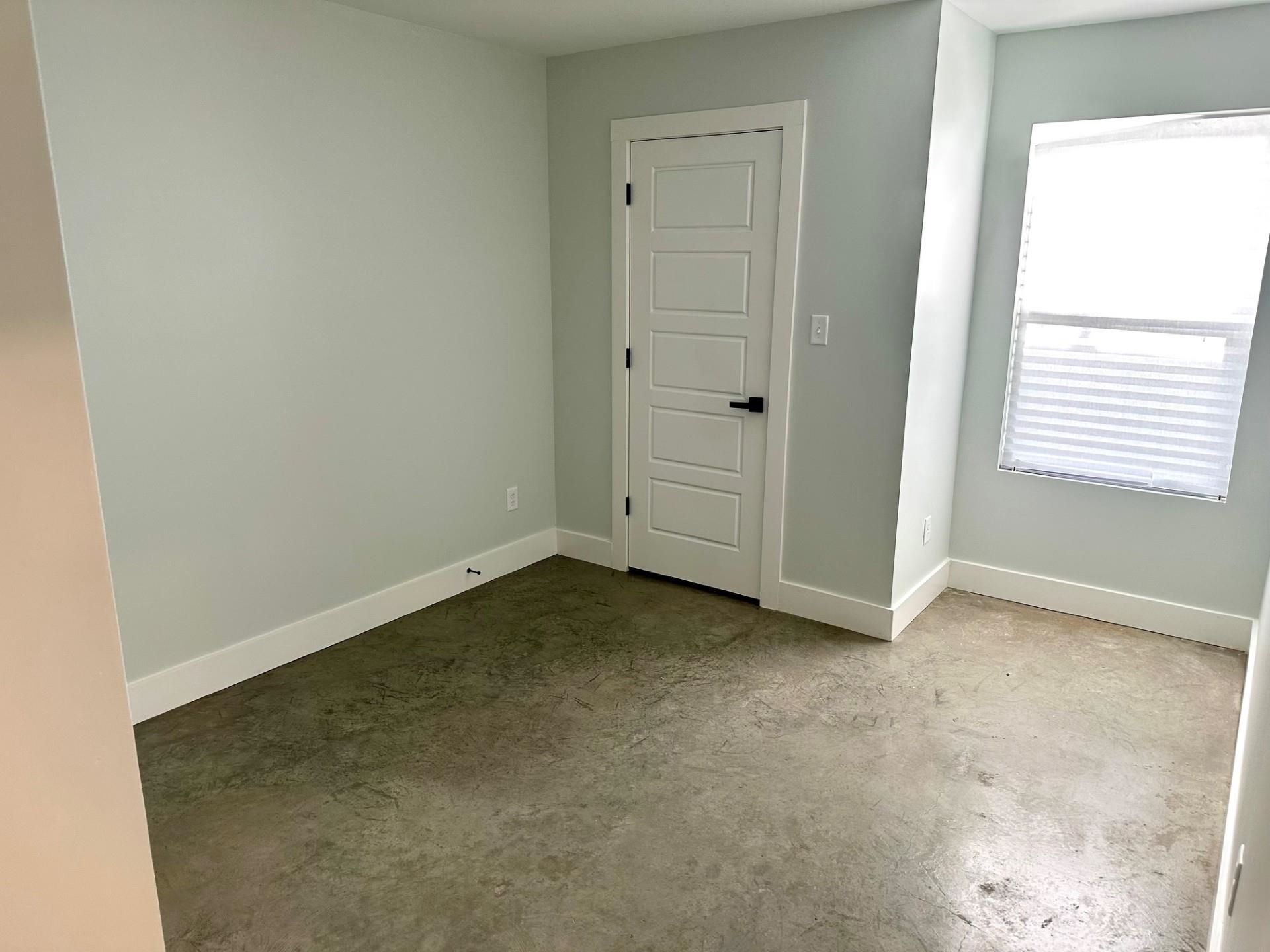 853 Hanley Street Memphis, TN 38114 - Photo 9 of 12 Spare room with unfinished concrete floors and baseboards