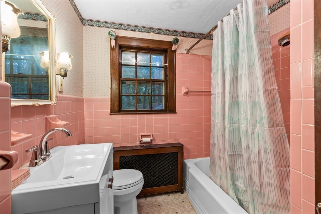 19 Forest Road Wakefield, MA 01880 - Photo 15 of 30 a bathroom with a sink toilet and shower