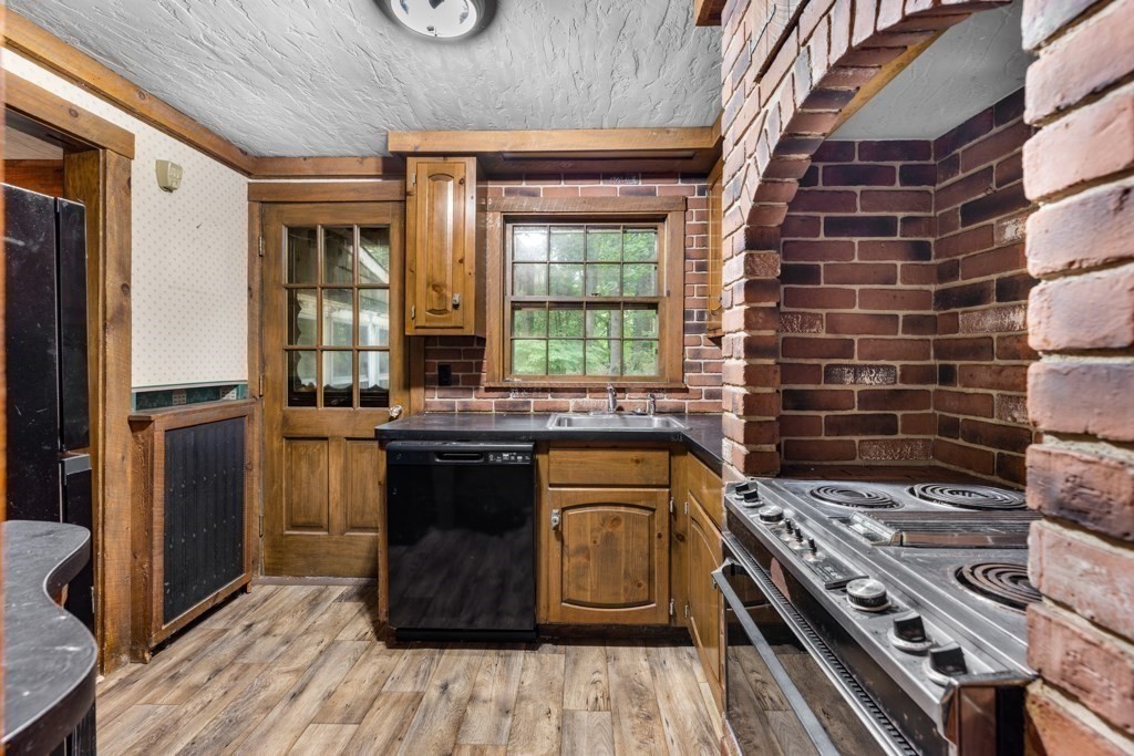 19 Forest Road Wakefield, MA 01880 - Photo 18 of 30 a kitchen with a stove and a refrigerator