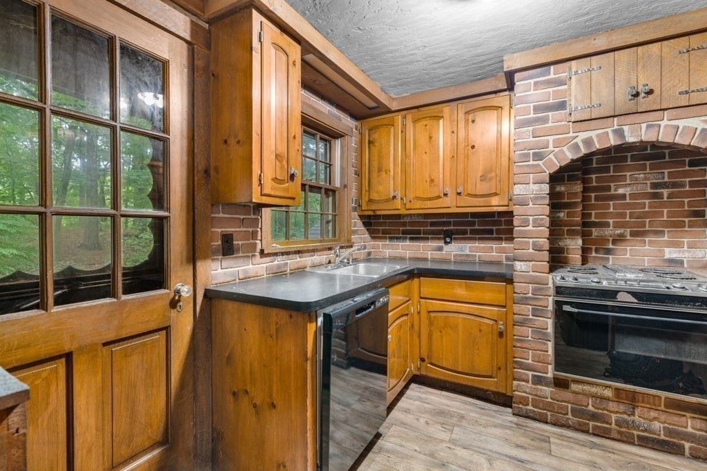 19 Forest Road Wakefield, MA 01880 - Photo 19 of 30 a kitchen with stainless steel appliances granite countertop a sink and cabinets